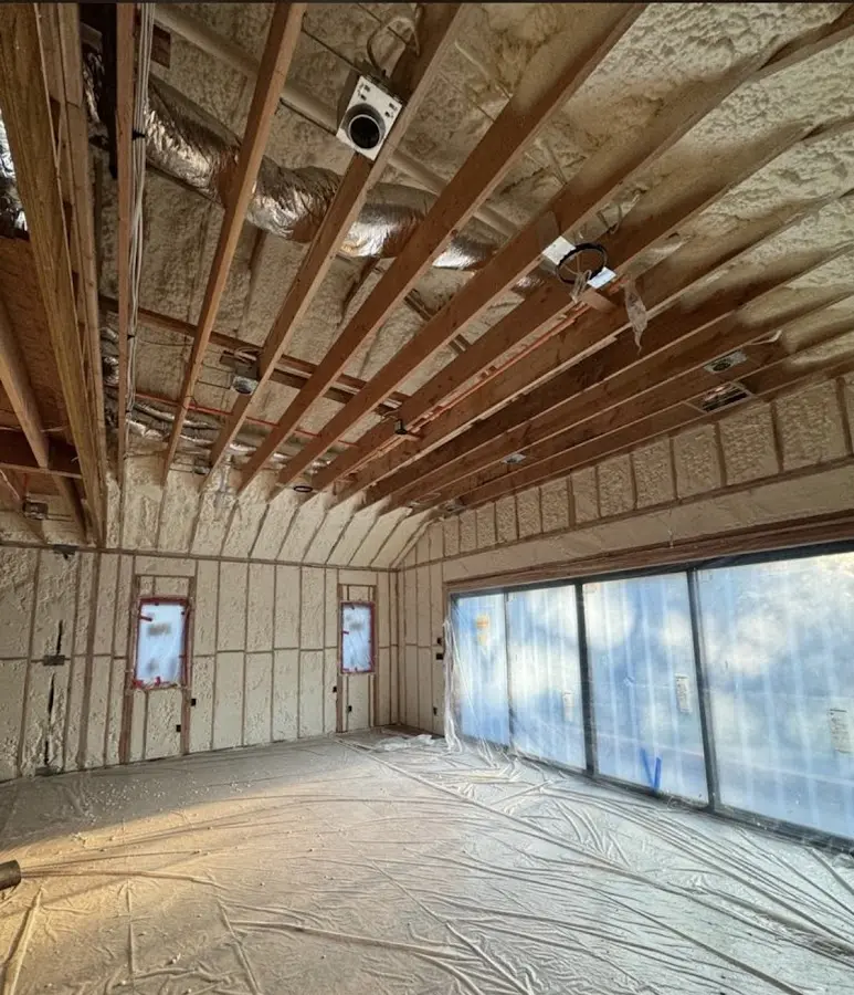 Interior walls and ceiling insulated with spray foam during new construction in Nantucket
